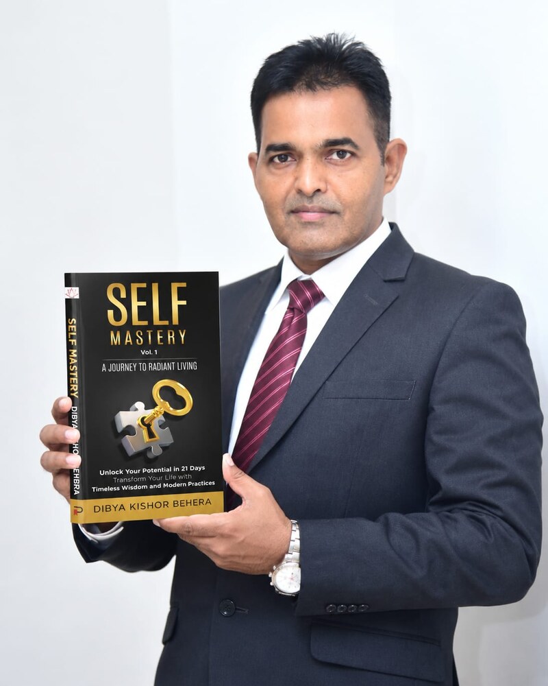Dibya Kishor Behera, published author of Self Mastery Vol. 1, holding his paperback